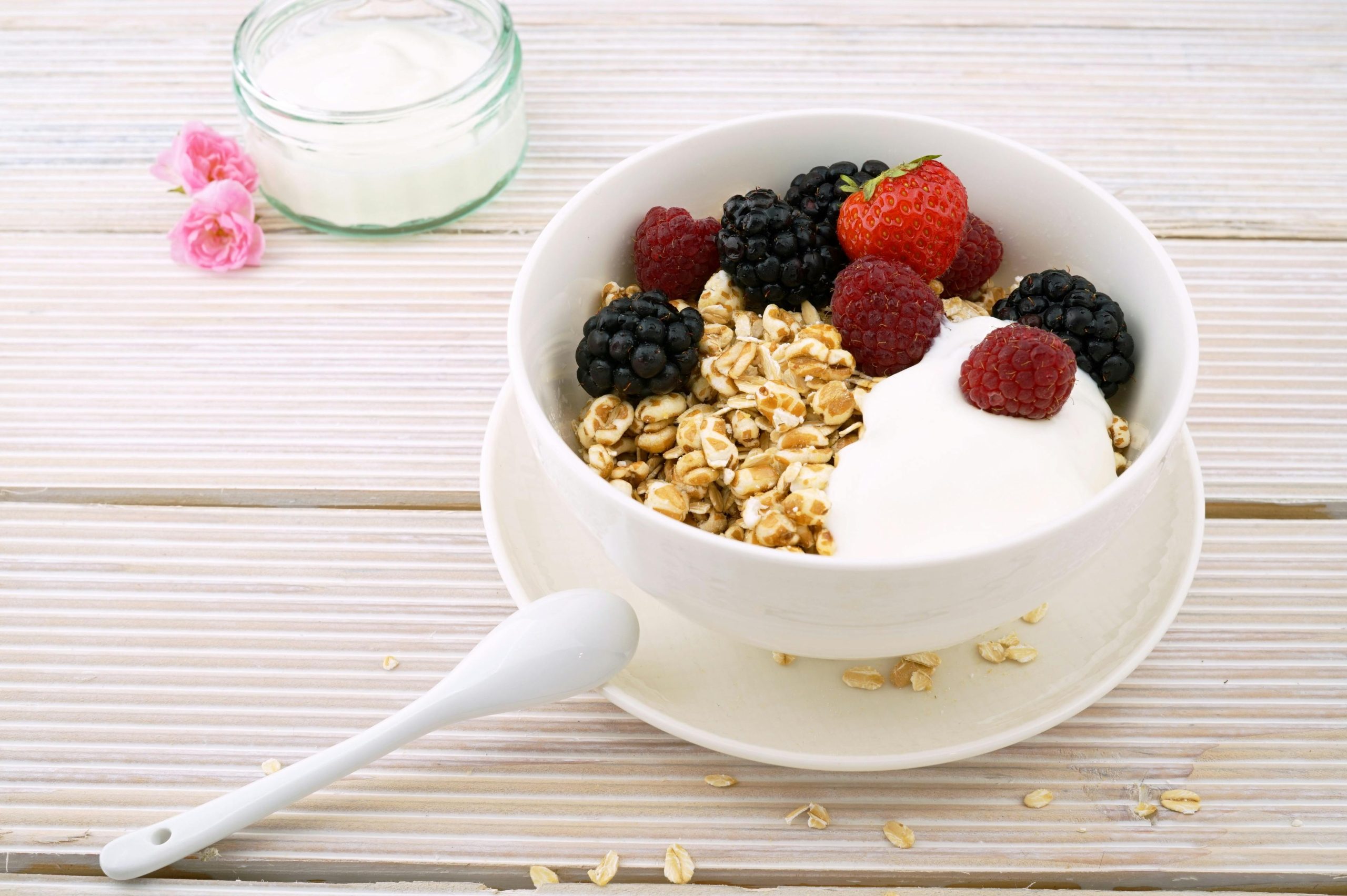 oatmeal with yogurt and berries in a ceramic bowl